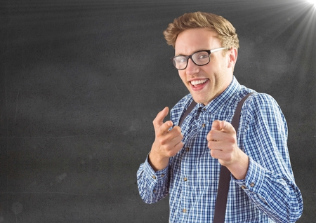 Digital composite of Nerd man pointing against grey wall with flareの写真素材
