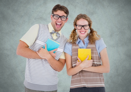 Digital composite of Nerd couple against light grey background with grunge overlayの写真素材