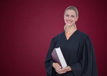 Digital composite of Female judge with book against maroon backgroundの写真素材