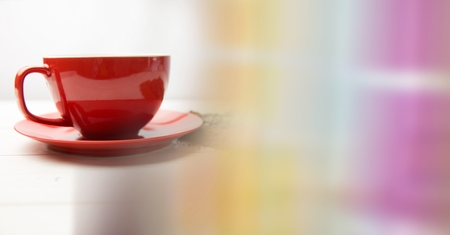 Digital composite of Red coffee cup with beans and blurry rainbow transitionの写真素材