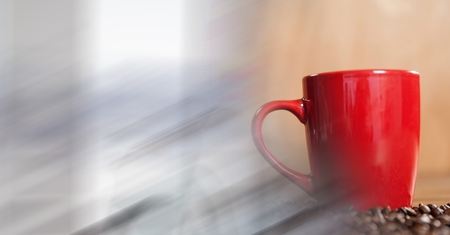 Digital composite of Red coffee cup with beans and blurry white transitionの写真素材