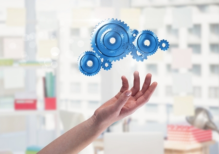 Digital composite of Open hand with cog gearsの写真素材
