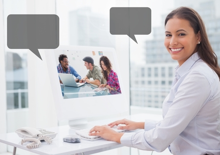 Digital composite of Woman on computer with contract meeting with empty chat bubblesの写真素材