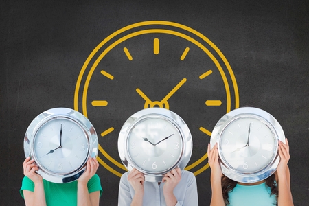 Digital composite of Women holding a clock against background with clockの写真素材