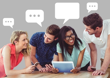 Digital composite of People discussing presentation on tablet with empty chat bubbles