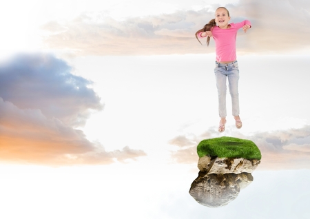 Digital composite of Young Girl jumping on floating rock platform  in skyの写真素材