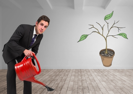 Digital composite of Man holding watering can and Drawing of Plant branches and leaves on wallの写真素材