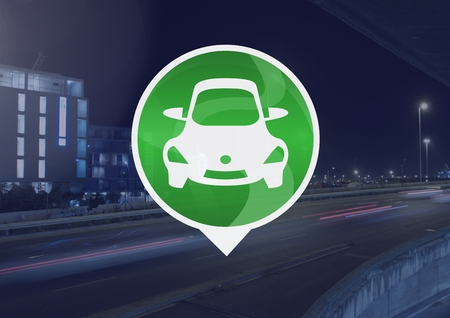 Digital composite of car icon on city roadの写真素材