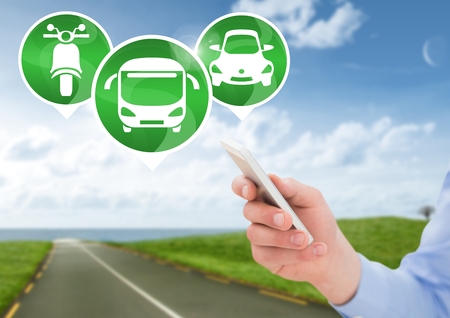 Digital composite of Hand holding phone with transport icons on road
