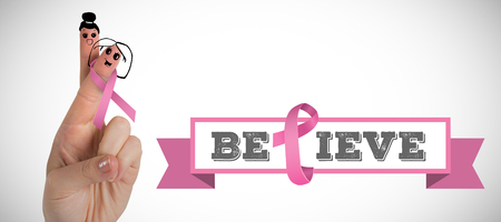 Cropped hand with pink breast cancer awareness ribbon against white background with vignetteの写真素材