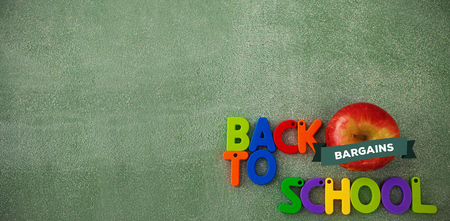back to school against colorful back to school text blocks with appleの写真素材