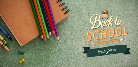 back to school against high angle view of colored pencils with bookの写真素材