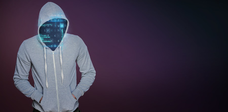 Robber in gray hoodie with hands in pockets against pink and purple colors background
