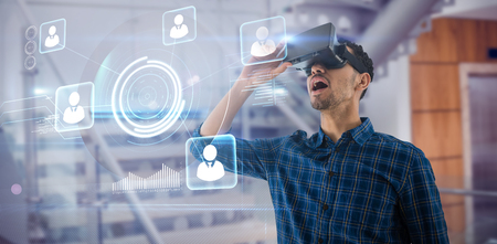 Surprised businessman with mouth open looking though virtual reality simulator against modern stairs...