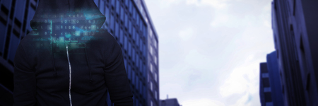 Robber wearing black hoodie against high angle view of crowded buildings in city