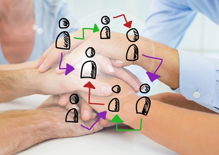 Digital composite of Doodle of connected people icons against images of peoples hands together