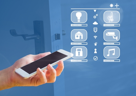 Digital composite of Hand holding phone with smart home interface at home
