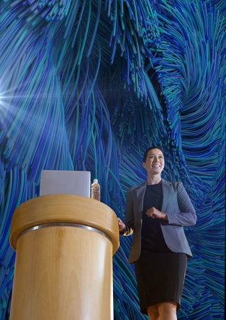 Digital composite of hero shot of female presenter against abstract 3d backgroundの写真素材