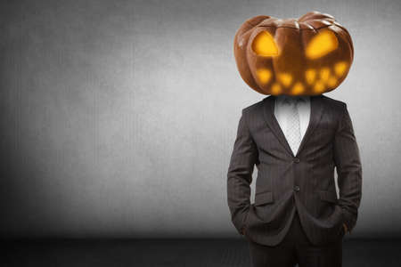 Digital composite image of Pumpkin head businessman with copy spaceの写真素材