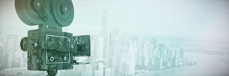 Black film reel camera with tripod against white backgroundの写真素材