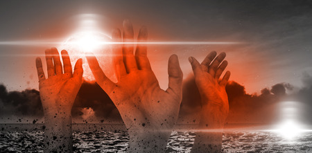Digital image of cropped hands against sky at nightの写真素材