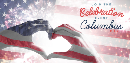 Hands making heart shape on the beach against close-up of an flagの写真素材