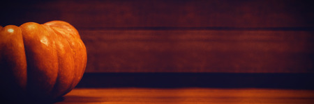 Pumpkin on wooden table during Halloweenの写真素材