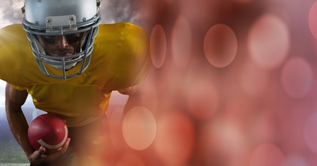 Digital composite of American football player with sparkles transitionの写真素材