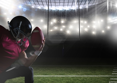 Digital composite of american football  player kneeling in stadiumの写真素材