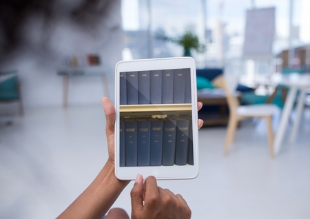 Digital composite of Bookshelf on tablet screen