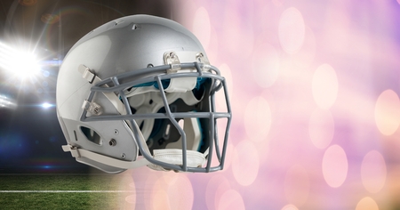 Digital composite of American football helmet with stadium transitionの写真素材