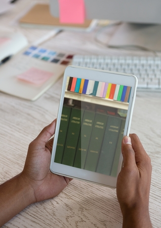 Digital composite of Bookshelf on tablet screen