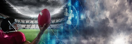 Digital composite of American football player with stadium transitionの写真素材