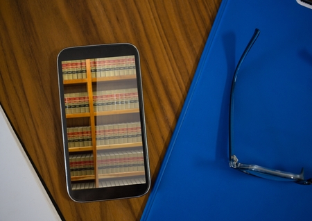 Digital composite of Bookshelf on mobile-phone screenの写真素材