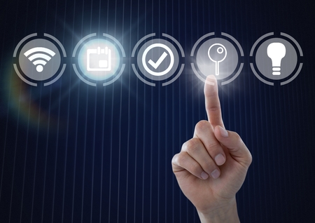 Digital composite of Hand touching icons interface of internet of things