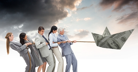 Digital composite of Business people pulling paper money dollar boatの写真素材
