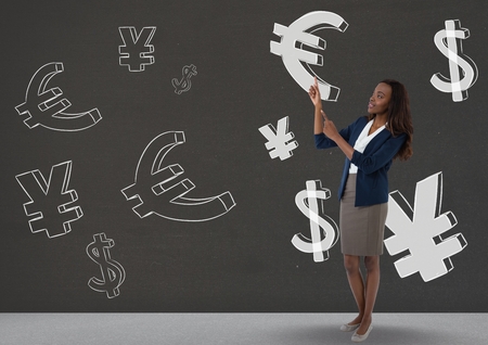 Digital composite of happy woman pointing up in front of money on wallの写真素材