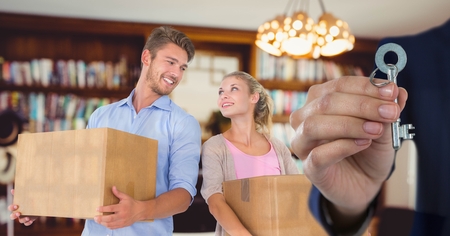 Digital composite of people moving boxes into new home with key