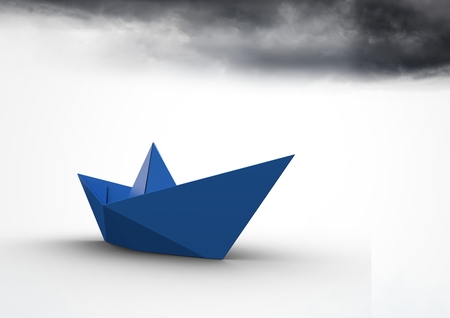Digital composite of Paper boat with dark cloudsの写真素材
