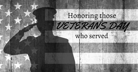 Digital composite of veterans day soldier in front of flagの写真素材