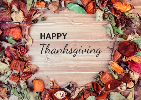 Digital composite of Happy thanksgiving text with Autumn leavesの写真素材