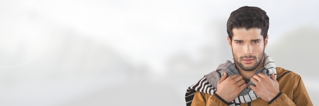 Digital composite of Man wearing scarf on bright bridgeの写真素材