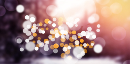 Close-up of defocused lights against snow covered treesの写真素材