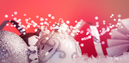 Close up view of christmas bauble against red backgroundの写真素材