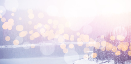 Scenic view of lake with bokeh in foreground during winterの写真素材