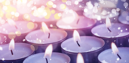 Close-up of  illuminated candles during Christmasの写真素材