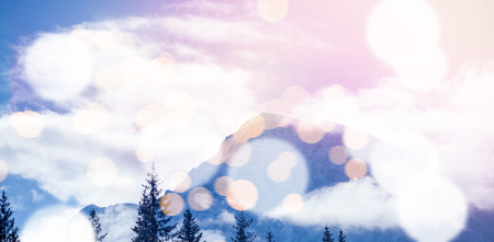 Scenic view of snow covered mountains with bokeh in foregroundの写真素材