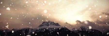 Scenic view of snowcapped mountains against cloudy skyの写真素材