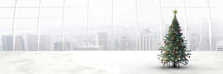 Digital composite of Christmas tree in long room with city windowsの写真素材