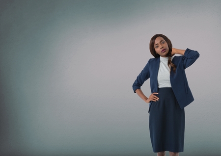 Digital composite of Businesswoman holding back of neck stressed and thinkingの写真素材